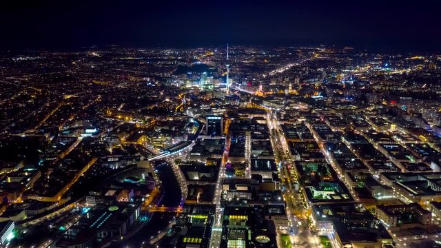 BERLIN, GERMANY - MAY,2019: Aerial drone timelapse hyperlapse view of Berlin city centre from above at night.
