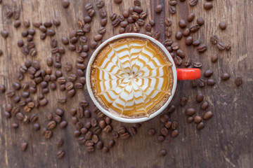 cup of coffee on wooden background