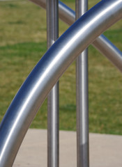 Close-up view of stainless steel tubes from a sport equipment installation in a public park