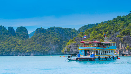 Fresh blue sea at Koh Samui in Thailand with islands and fishing boats