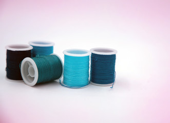 Roll of thread put on white background,show texture,for needle work