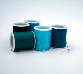 Roll of thread put on white background,show texture,for needle work