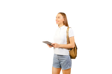 Girl with a tablet on a white background. stylish young woman with backpack and digital tablet.