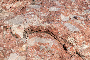 Background red stone mixed composition granites and quartz rocks