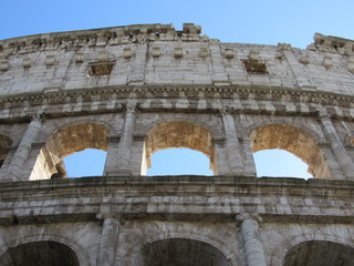 Naklejka premium Close up of the window arches of the Colosseum, or Flavian Amphitheater, located in Rome, Italy 