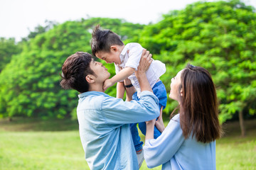 parents play with kid outdoor