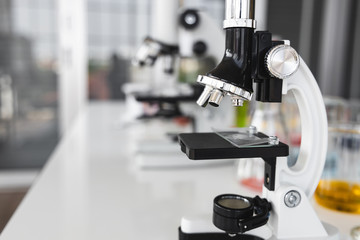 Microscope in laboratory. Medical equipment technology and research concept.