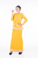Beautiful female Asian model in various poses wearing modern kurung, a Malaysian traditional wear isolated on white background. Beauty and fashion concept. Full length portrait