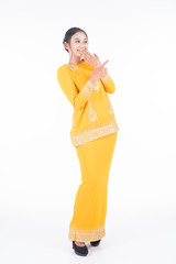 Beautiful female Asian model in various poses wearing modern kurung, a Malaysian traditional wear isolated on white background. Beauty and fashion concept. Full length portrait