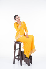 Beautiful female Asian model in various poses wearing modern kurung, a Malaysian traditional wear isolated on white background. Beauty and fashion concept. Full length portrait