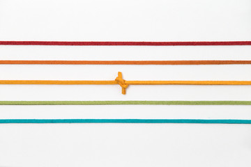 color strings line pattern on white background. orange thread with knot isolated. 