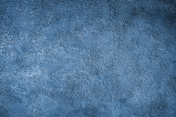 Classic blue stucco background close up, painted rough cement texture backdrop, grunge concrete textured wall, art decorative plaster board, matt dark blue vintage wallpaper, empty place, copy space