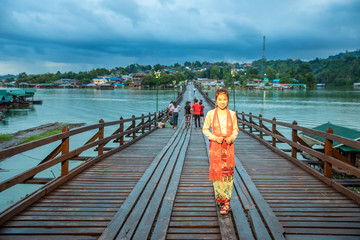 Thai women get dress traditional costume of Mon tribal at Mon village, Sangkhlaburi, Kanchanaburi,...