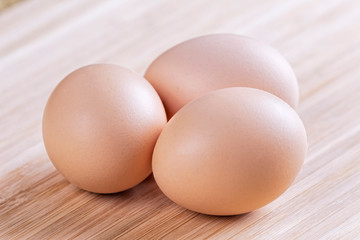 A background of farm fresh brown eggs
