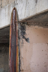 Grunge urban decay pattern on bridge marked 1974, vertical
