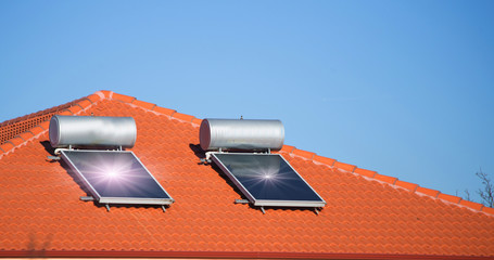 solar heater panels on the roof sun beams