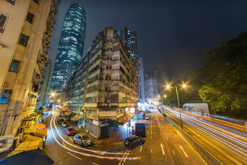 Fototapeta na wymiar Old and modern building in Hong Kong city at night