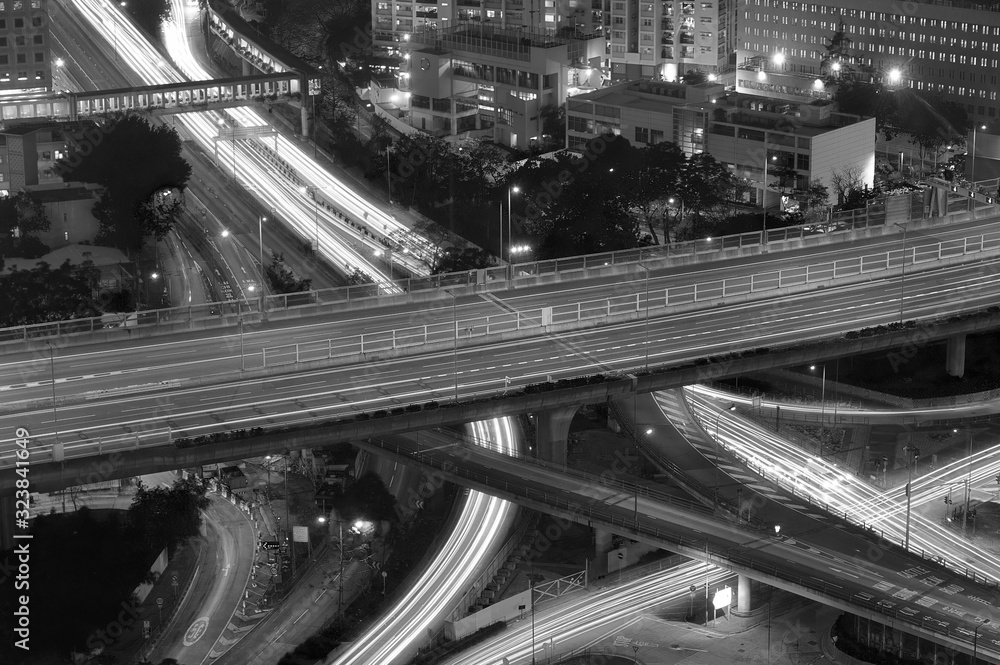 Wall mural traffic on highway in downtown in black and white