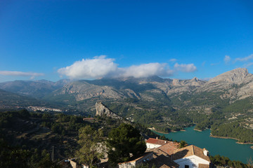 Fototapeta na wymiar View of the Guadalest reservoir lake with azure water from the castle, Castell de Guadalest, Spain