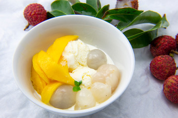Garnished lychee and vanilla ice cream