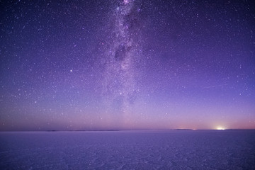 Salar de Uyuni salt flat during the starry night, Bolivia - obrazy, fototapety, plakaty