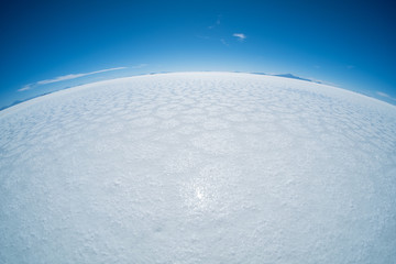 Salar de Uyuni salt flat during sunny cloudless day, Bolivia