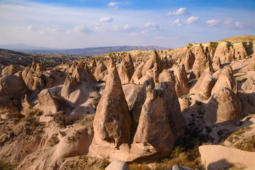 Fototapeta na wymiar Devrent Valley / Imaginary Valley, a valley full of unique rock formations in Cappadocia, Turkey