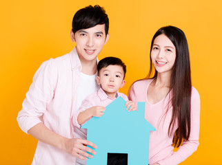 young family  hands holding paper house