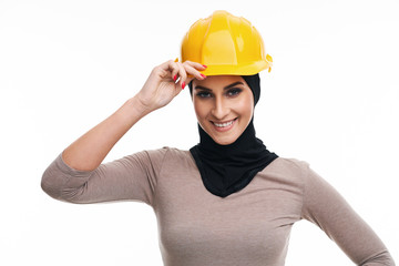 Muslim woman in helmet over white background