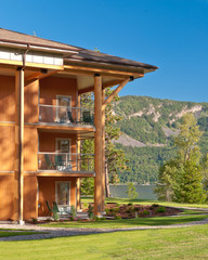 Wooden resort building over beautiful mountain lake.