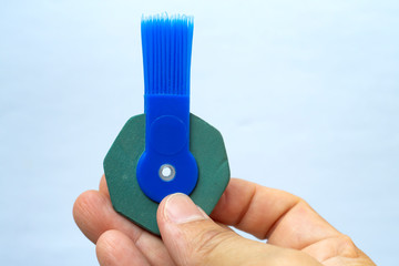 Woman's right hand holding vintage pen round rubber eraser with brush, Close up shot, Stationery...
