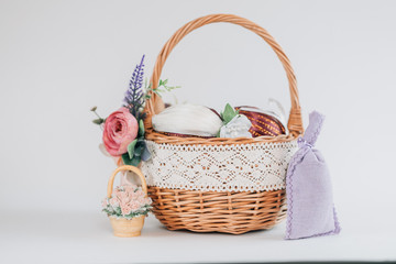 Fototapeta na wymiar Easter. Basket with eggs on a pastel pink background