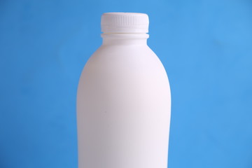 liquid yogurt bottle in color background