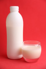 liquid yogurt bottle in color background