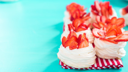 pavlova meringue nests with strawberry cream and fresh strawberries