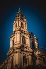 Fototapeta premium Big tower of St. Nicholas Church in Prague