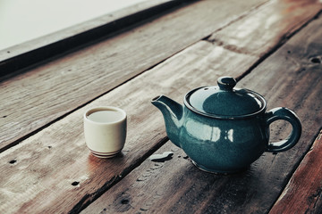 Hot tea, Tea cup with pot on wood table