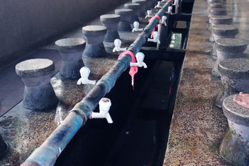 Muslim Ablution for Pray. Fountains for ablution in the Carmichael College Mosque.Water Tab for...
