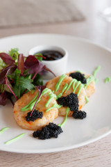 Crab patty cakes with salad mix