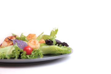 Seafoods - Shrimps, Sea Scallops, Squids and Salmon. Garnished with Fresh Raw Salad Leaf.