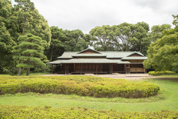 Fototapeta na wymiar Photograph of a temple with a beautiful green garden