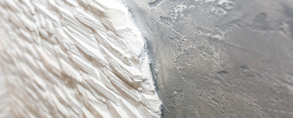 Wall with decorative bricks and concrete background. Maintenance repair works. Renovation in the flat. Restoration indoors.