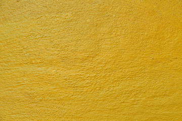 Gold background surface of cement gold color blank for design