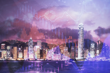 Double exposure of forex chart drawings over cityscape background. Concept of success.
