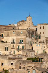Obraz premium View of the Sassi di Matera a historic district in the city of Matera, well-known for their ancient cave dwellings. Basilicata. Italy