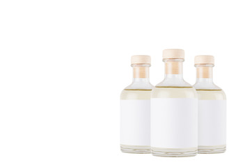 Group glass bottles for cosmetic, perfume, alcohol drink with  white label, cork, yellow liquid...
