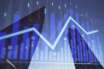 Forex chart on cityscape with tall buildings background multi exposure. Financial research concept.