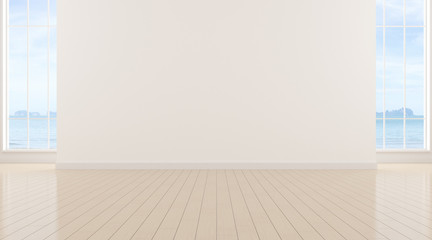 Perspective of empty modern living room on sea view background,The sun light cast shadow on the timber floor. - 3D rendering.