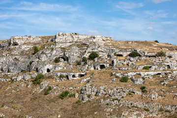 View of Gravina river canyon and park of the Rupestrian Churches of Matera with houses in caves di Murgia Timone near ancient town Matera (Sassi), , Basilicata,  Italy