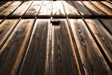 Close-up of a wooden door at sunset